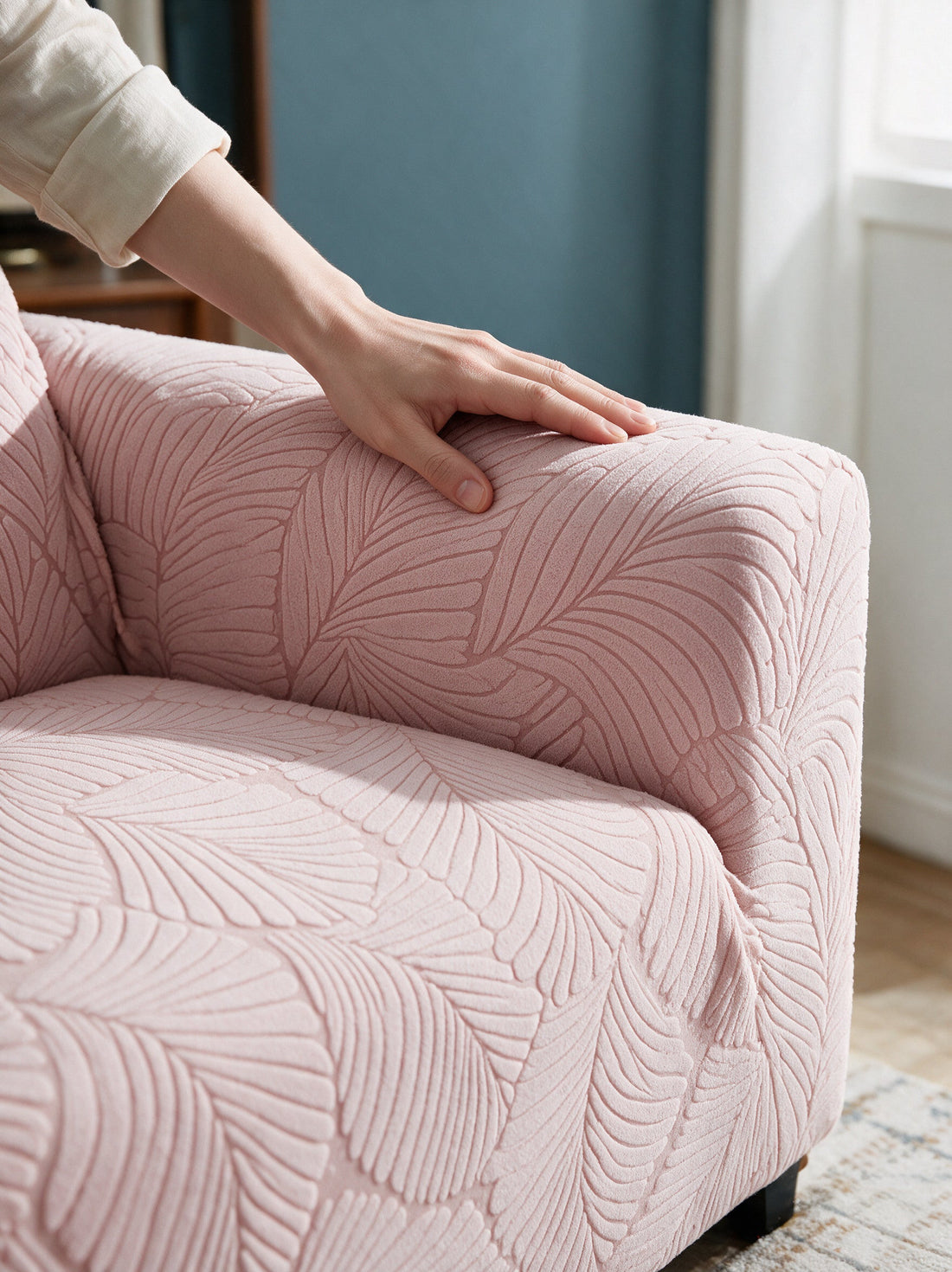 Close-up of the Avelia - Pink cover around a sofa arm