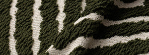 Atlas Geo Dark Green: close-up of the original throw fabric.