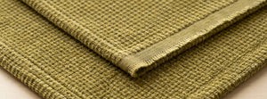 Coveri Green Tea throw fabric detail — AI-generated from product references.