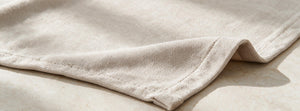 Norka Moon Beige throw fabric detail — AI-generated from product references.