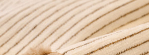 Pomelle Beige: close-up of the original throw fabric.