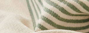Soft Tassel Pistachio Green: close-up of the original throw fabric.