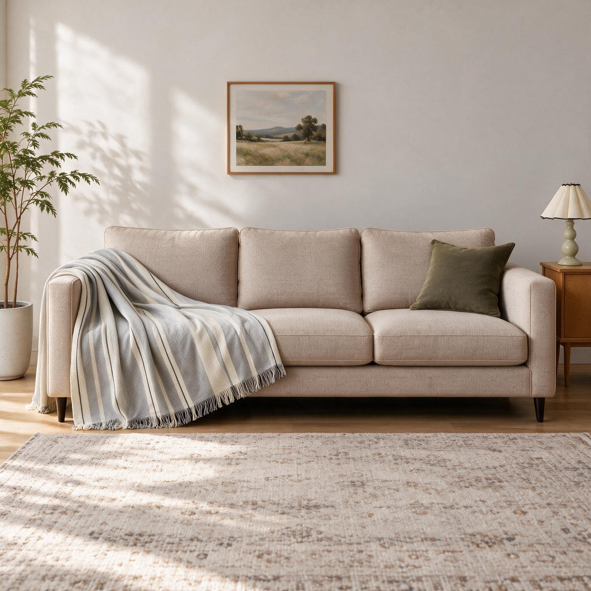 Accent Throw: illustrative throw styling on the same three-seat sofa