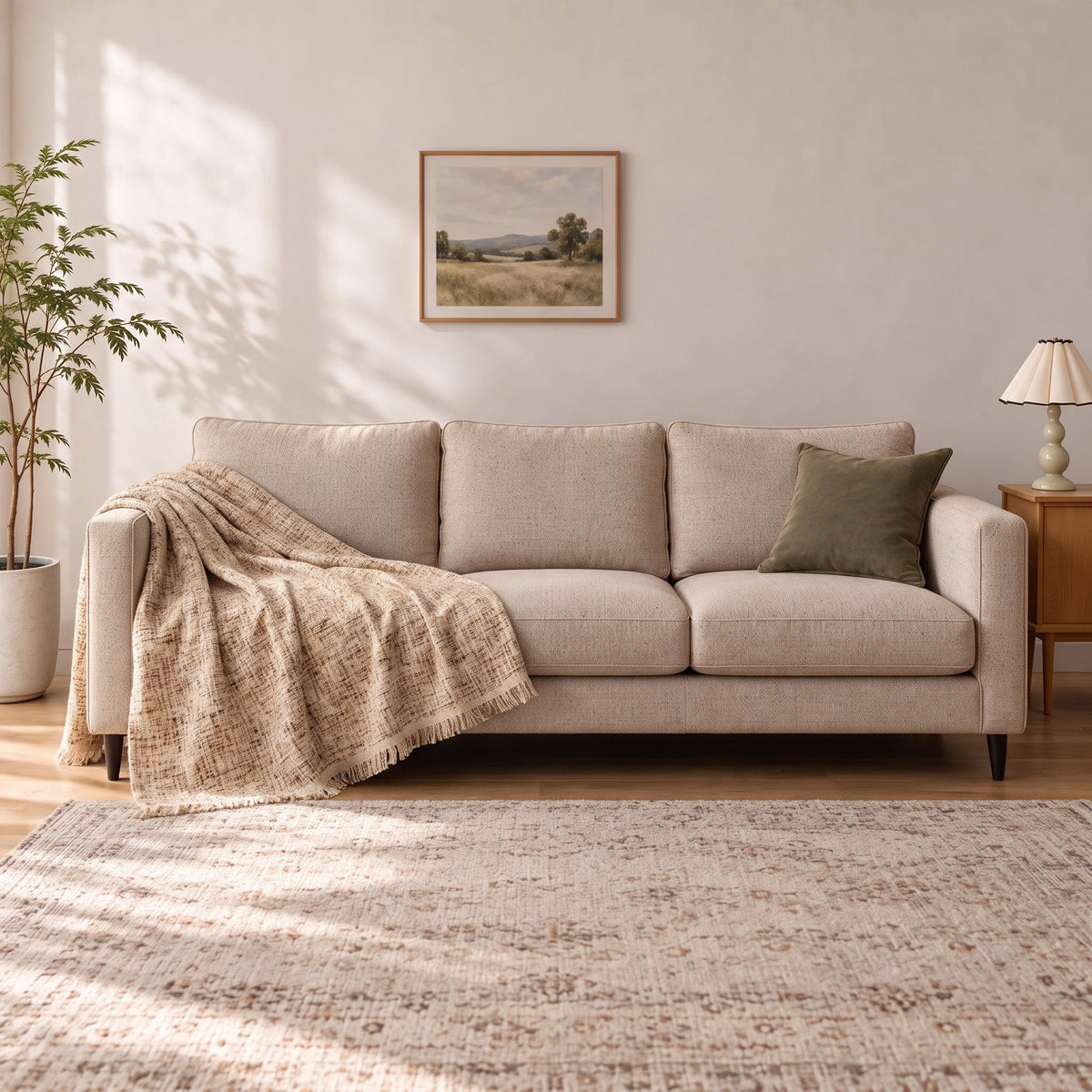 Accent Throw: illustrative throw styling on the same three-seat sofa